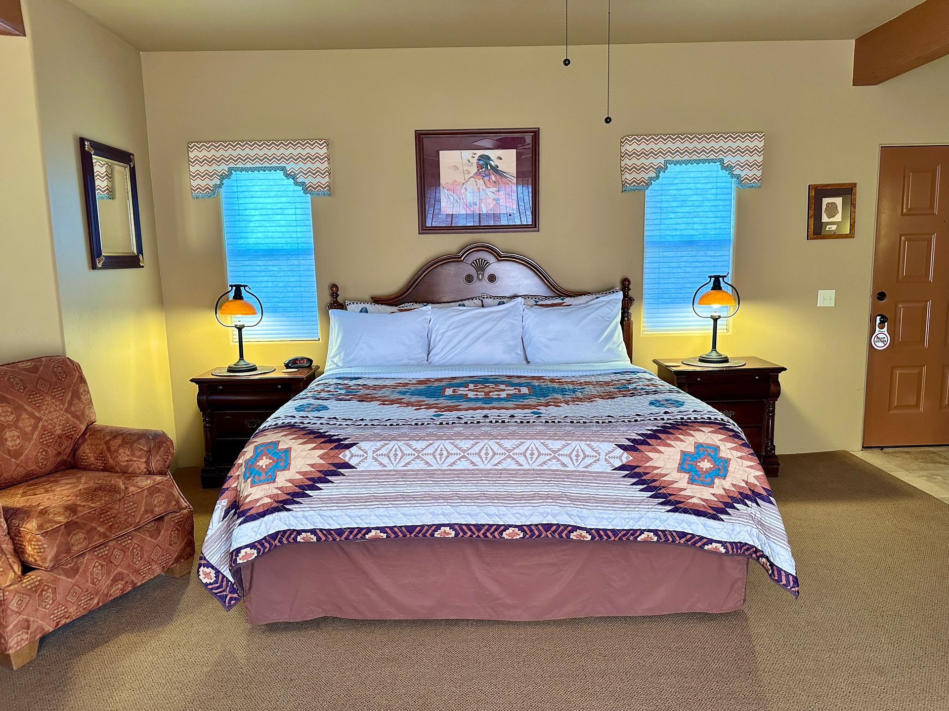 There is a king size bed in the middle of the room.