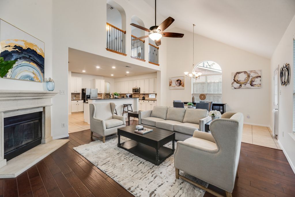 Bright, cozy furnished living room with sofa, coffee table, and warm natural light.