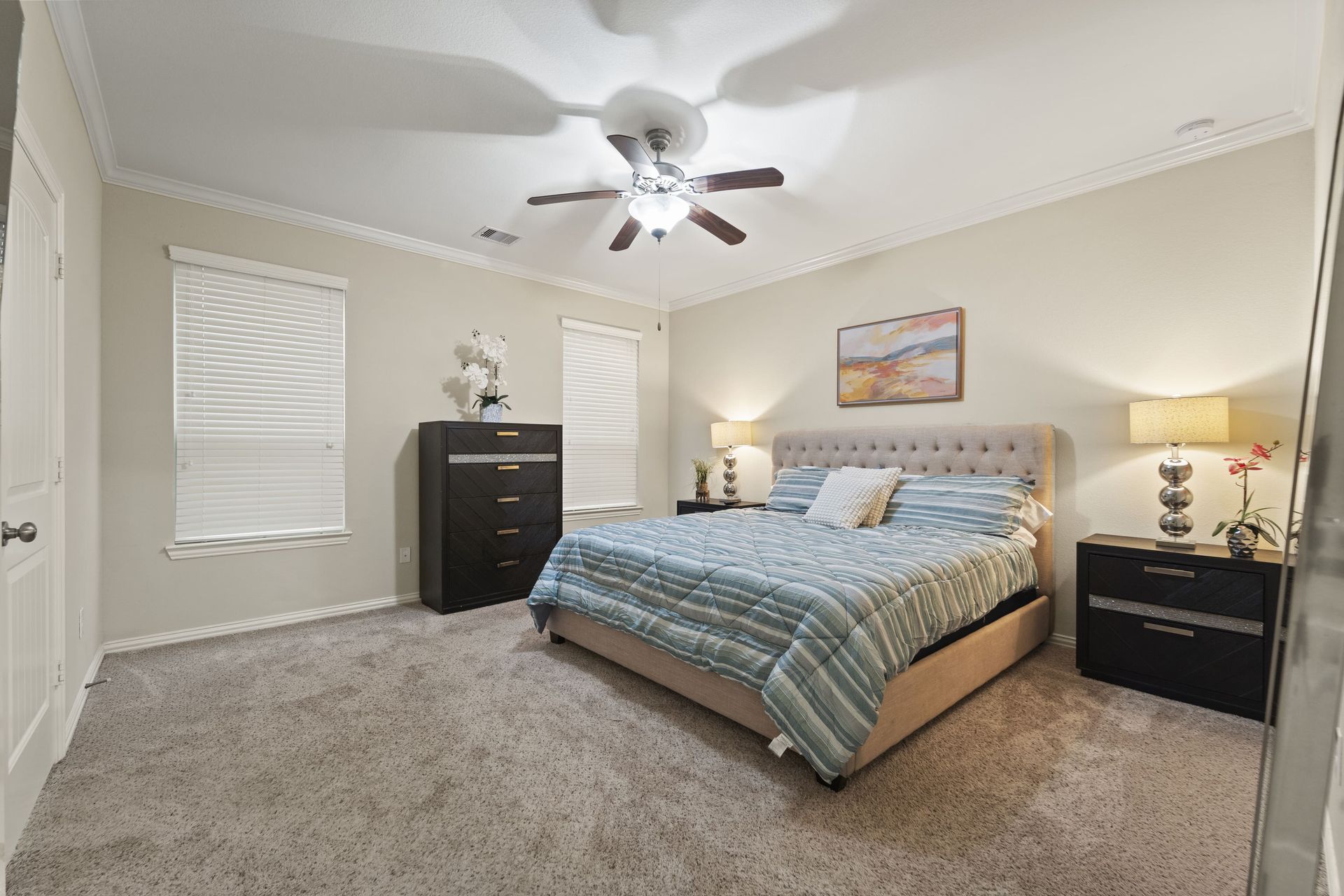 After: A luxurious staged bedroom of a home in Houston, Texas.