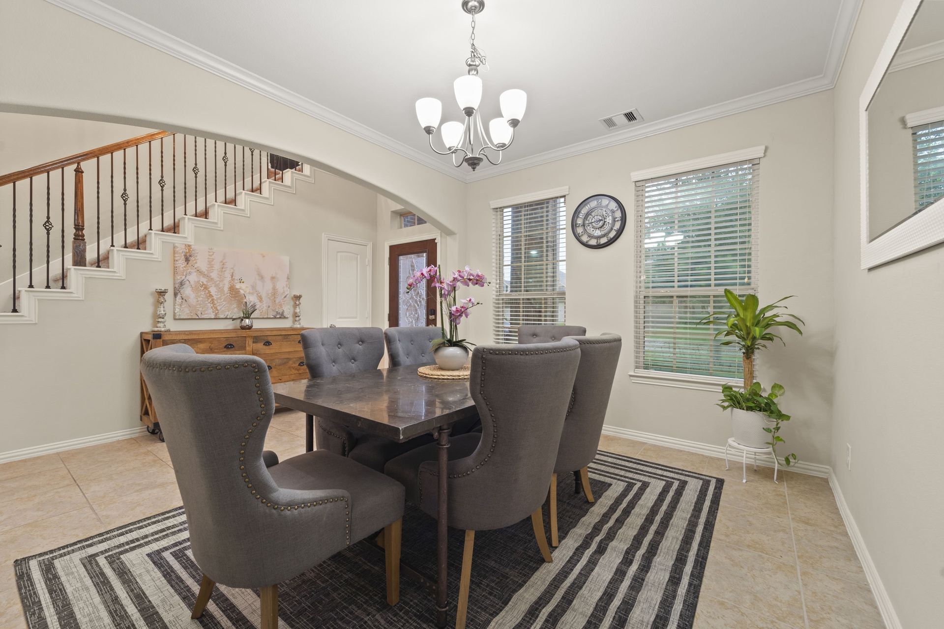 After: A luxurious staged living room & dining room of a home in Houston, Texas.