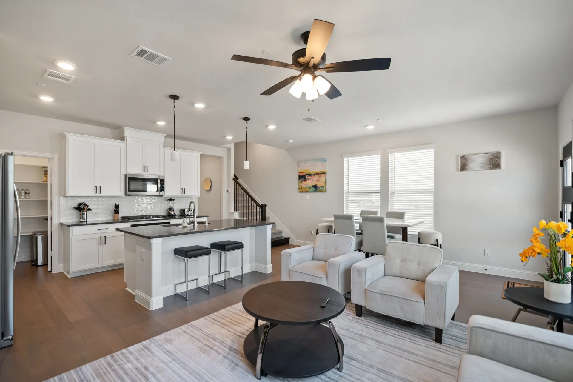After: A luxuriously staged living room of a townhome located in Plano, Texas.