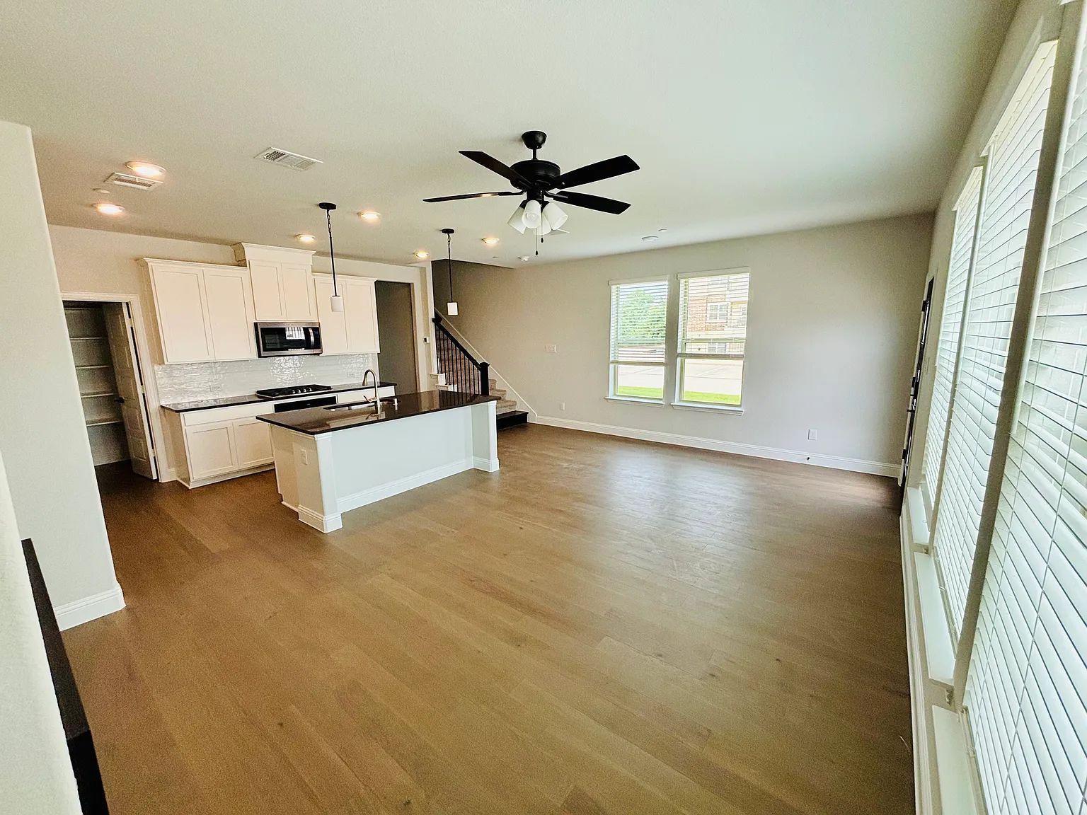 Before: A luxuriously empty living room of a townhome in Plano, Texas.