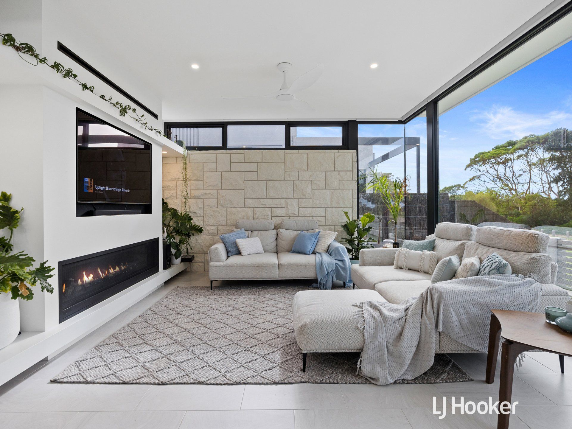 A living room with a couch and a fireplace