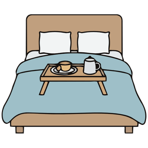 Bed with blue blanket, two pillows, and breakfast tray with coffee and a pastry.