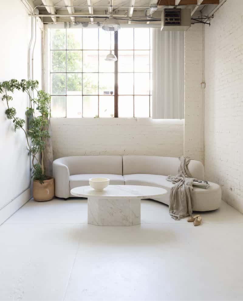 A living room with a couch and a coffee table.