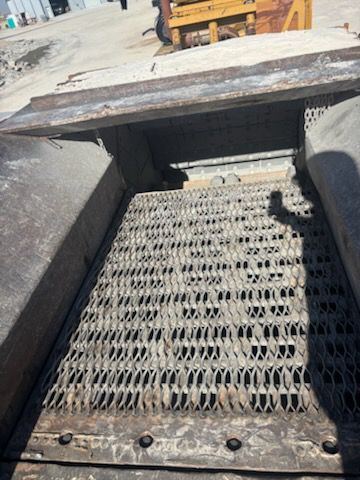 Gravel screening machine with a metal mesh.