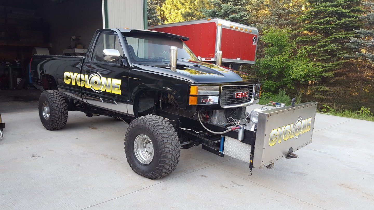 Black truck with decal on front and side