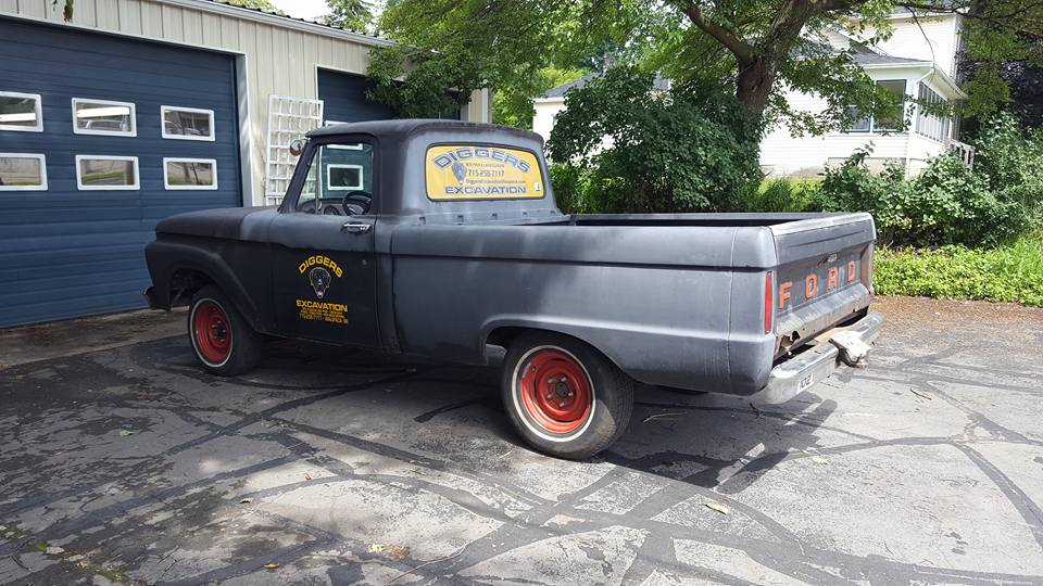 Old black truck with decals