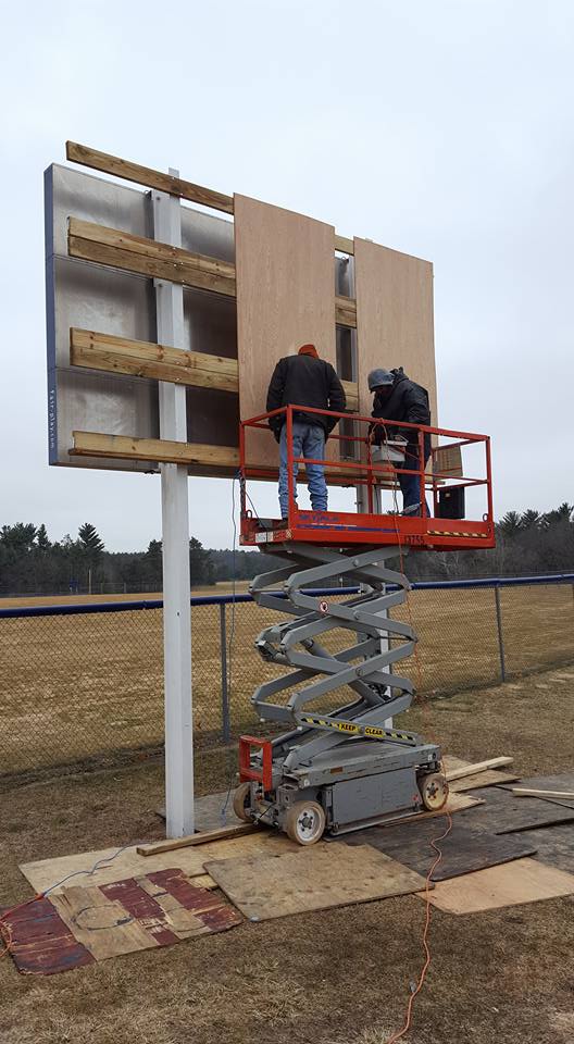 A billboard being hung