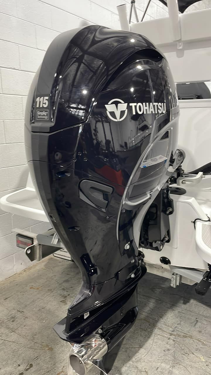 Black Tohatsu 115 Outboard Motor Mounted on a White Boat — In Tune Marine in West End, QLD