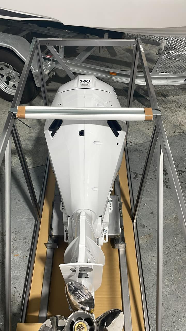 White Outboard Motor in a Shipping Crate — In Tune Marine in West End, QLD