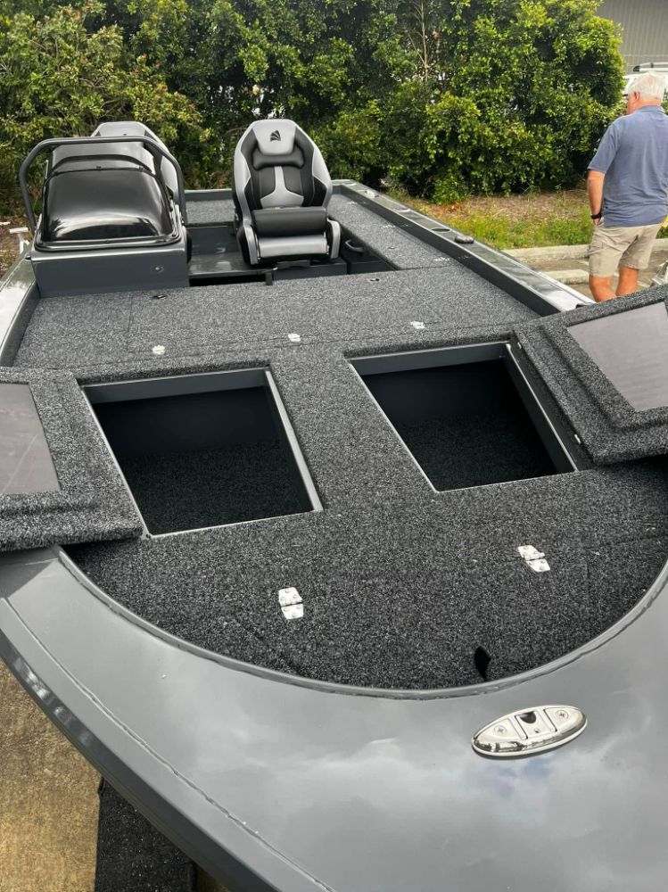 Gray Fishing Boat Deck With Two Open Storage Compartments — In Tune Marine in West End, QLD