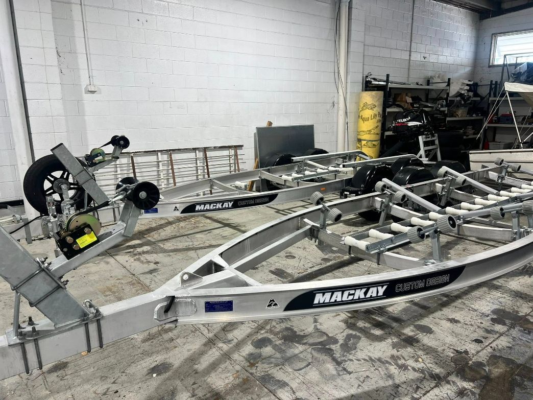 Two New Boat Trailers in a Workshop, With 