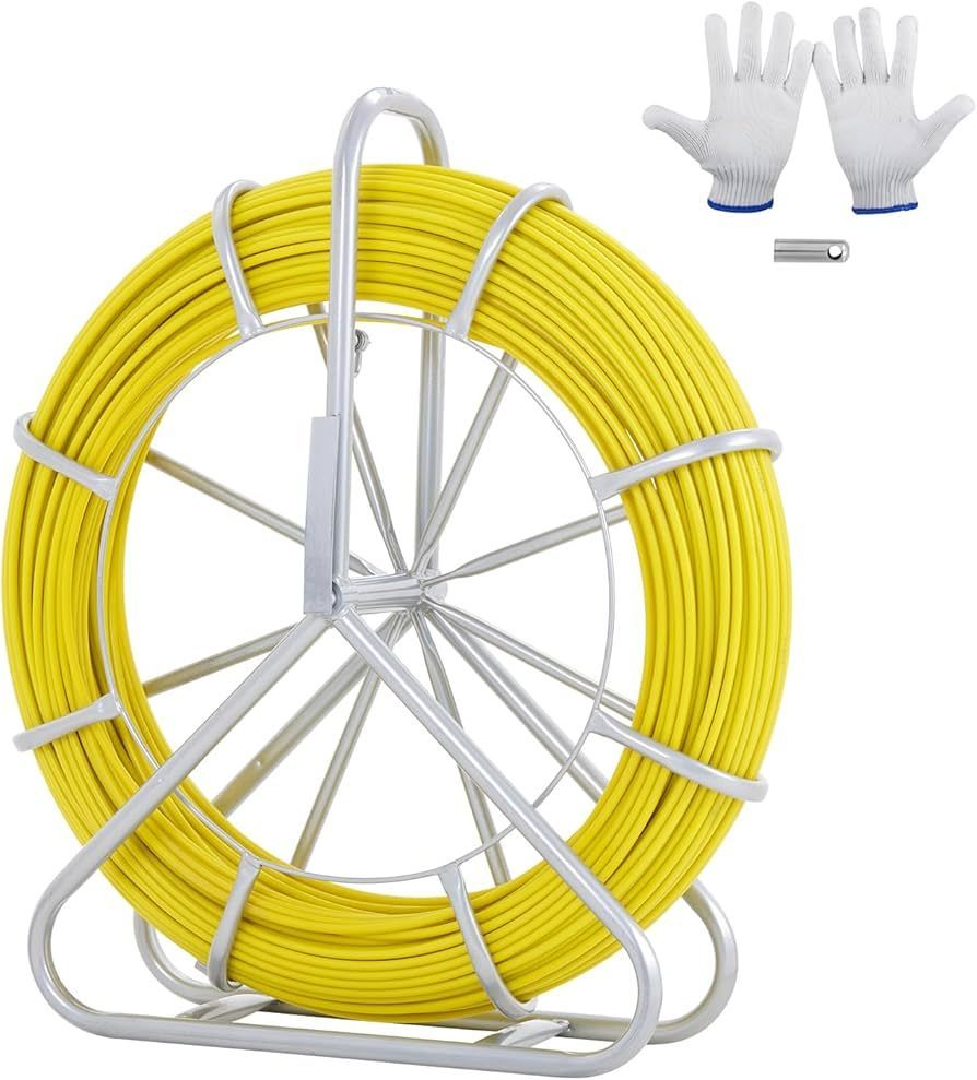 Yellow electrical fish tape on a metal reel, white work gloves, and a metal clip.