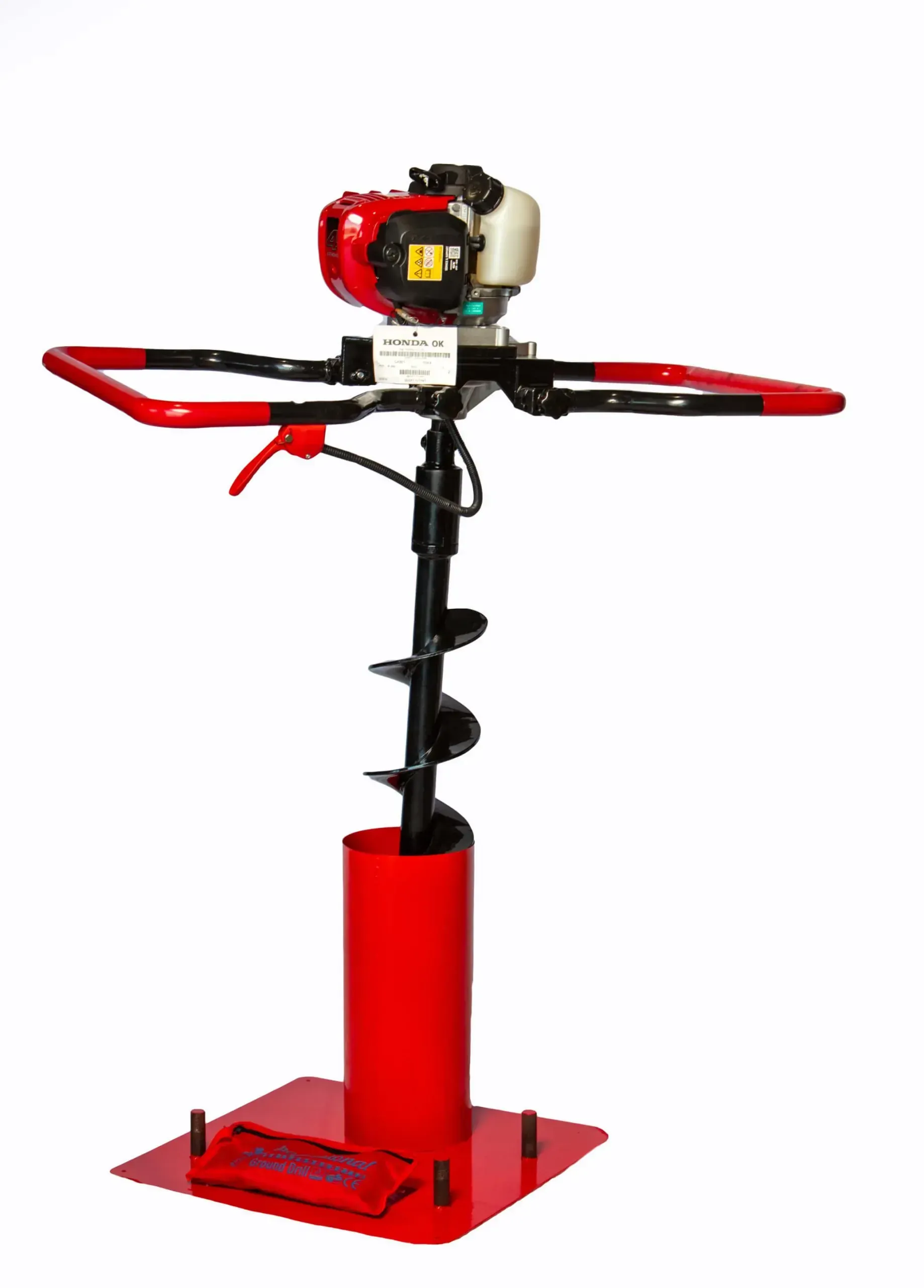 Red and black gas-powered earth auger with handle bars on a red steel base.