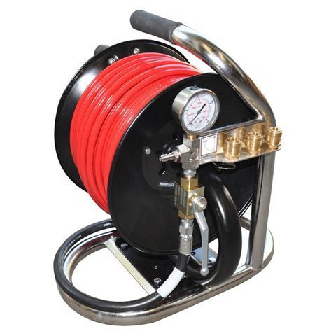 Red hose reel with pressure gauge on a metal frame.