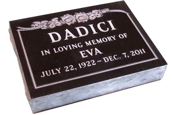 Dark memorial plaque reading “DADICI In Loving Memory of EVA July 22, 1922–Dec. 7, 2011”