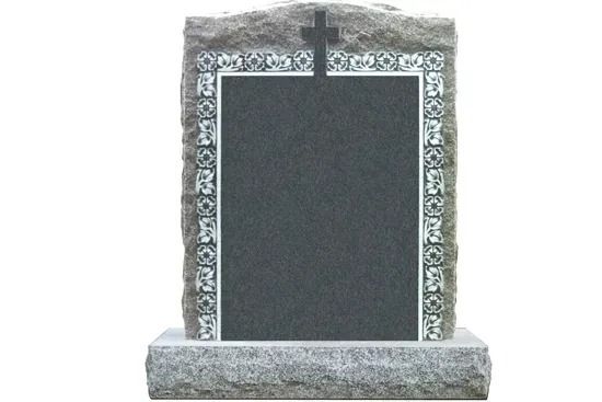 Gray tombstone with a decorative stone border and cross on top, set on a base.