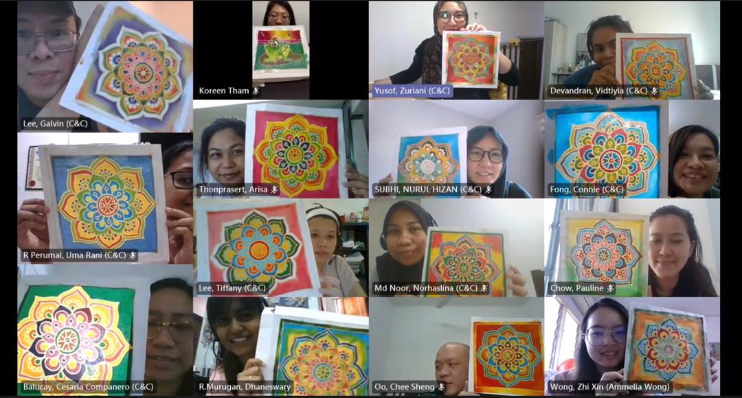 Group video call: People holding up colorful mandala art.