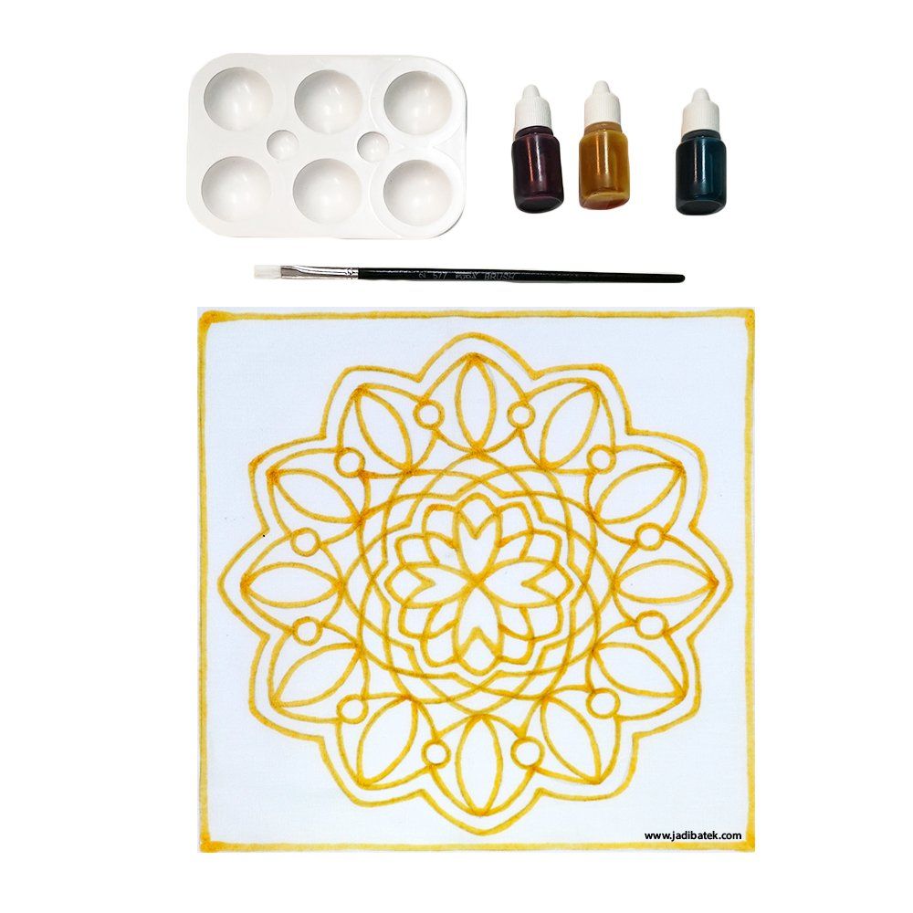 Painting kit with a mandala design, palette, paint bottles, and brush.
