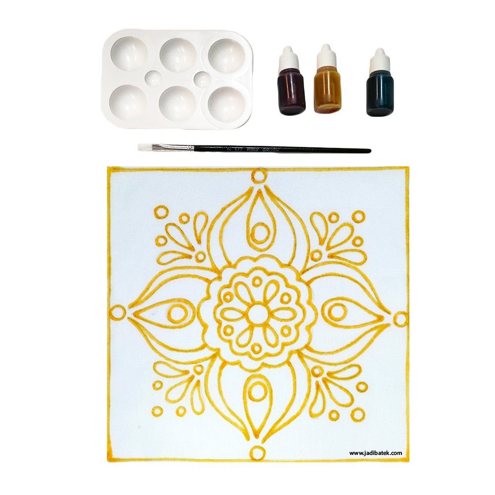 Glass art kit with paint, palette, brush, and a yellow floral pattern on a white square.