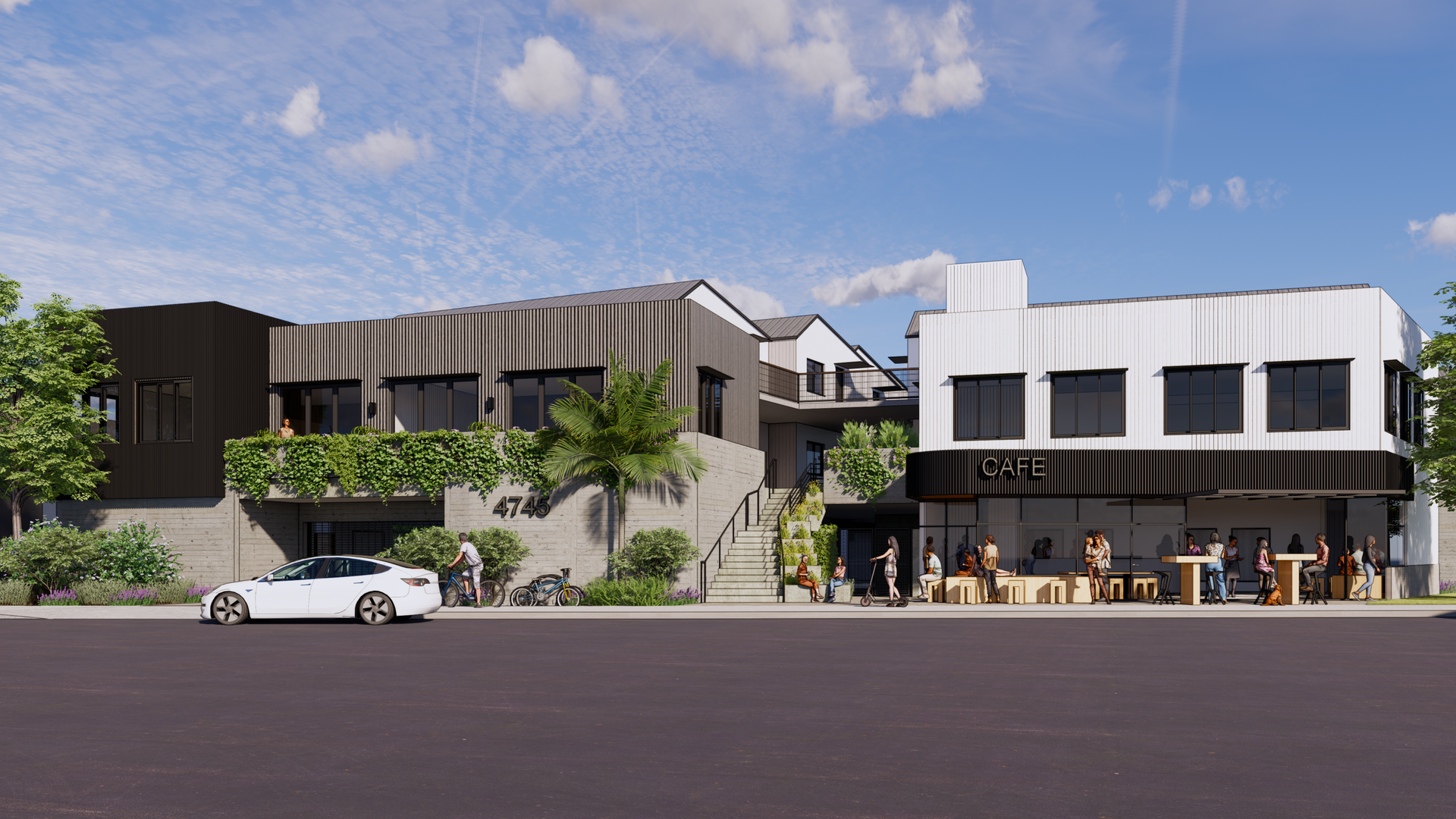 Modern commercial buildings with people gathered outside; white car parked in front.