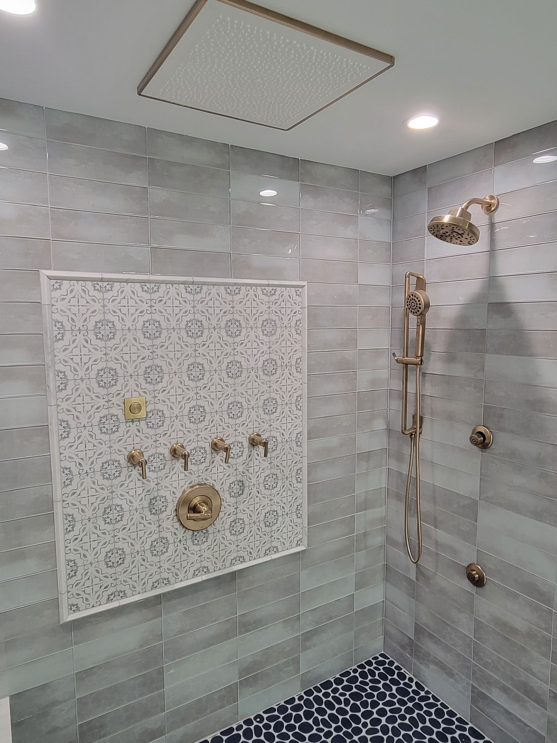 A bathroom with a shower and a picture on the wall.