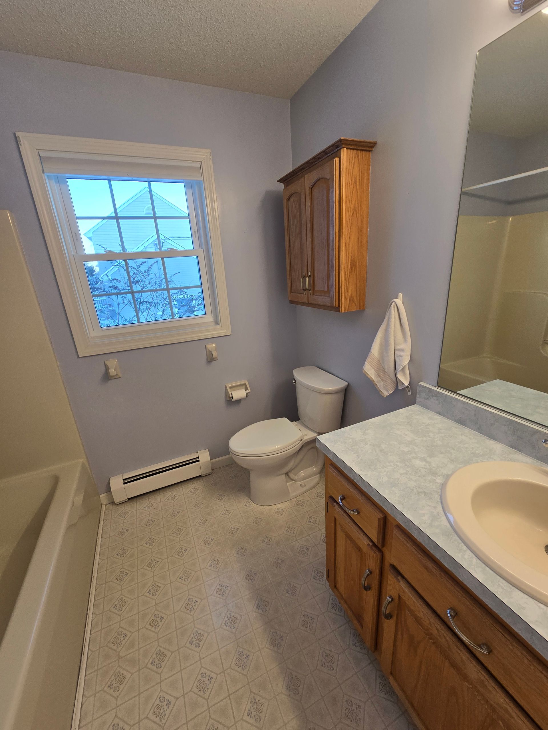 A bathroom with a bathtub and a shower being remodeled.