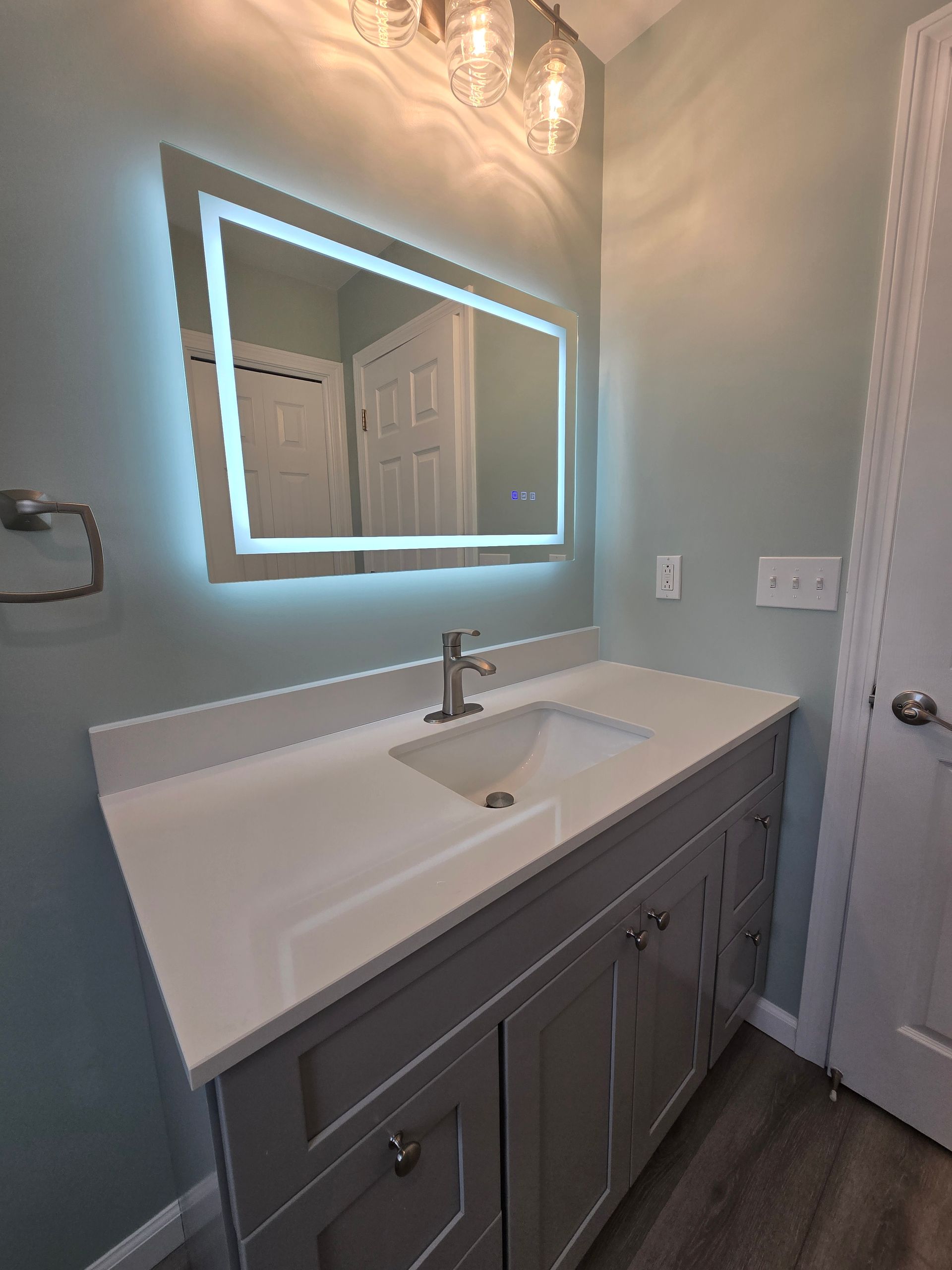 A bathtub with a brass shower head attached to it.
