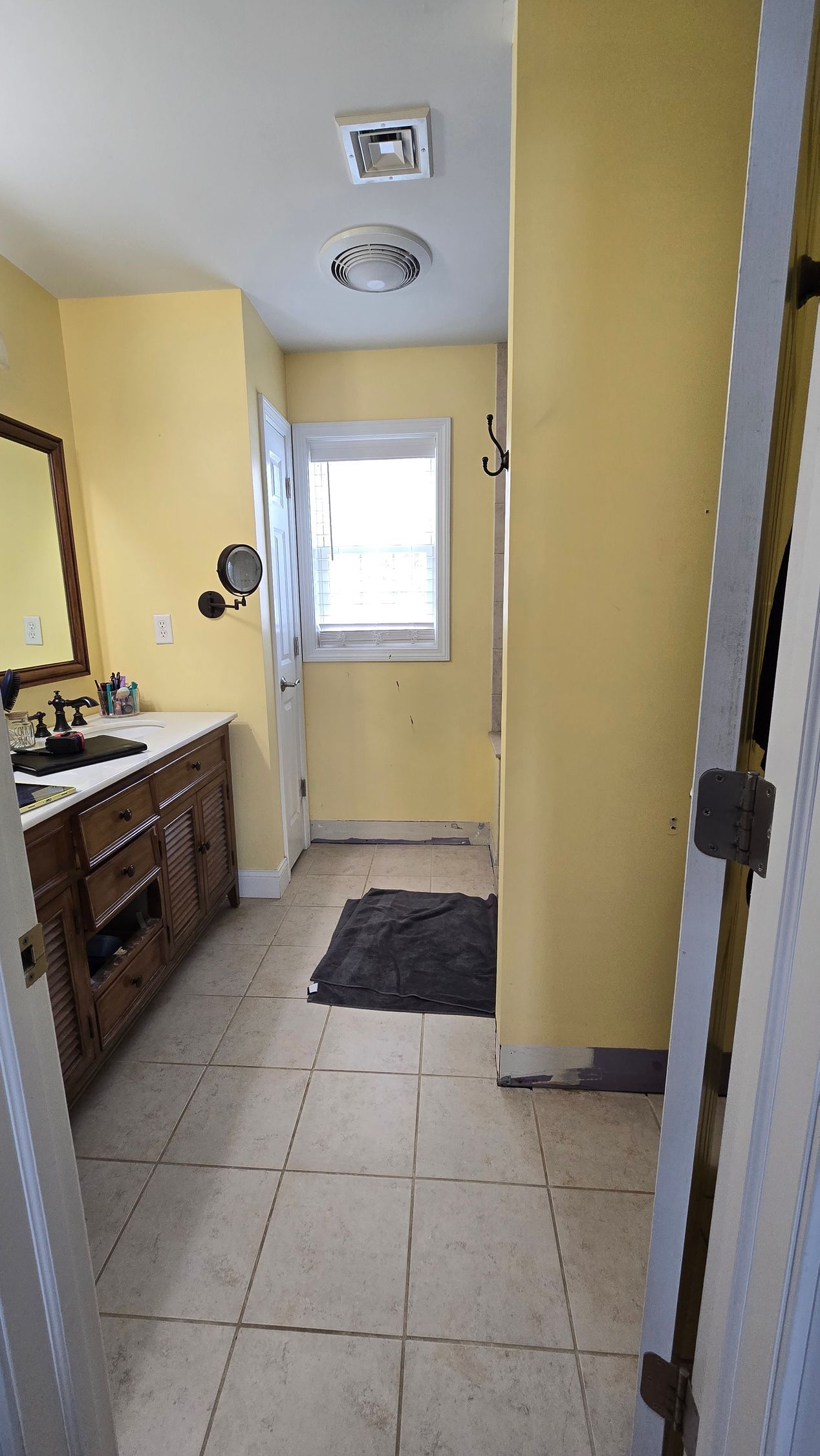 A bathroom with a bathtub and a shower head