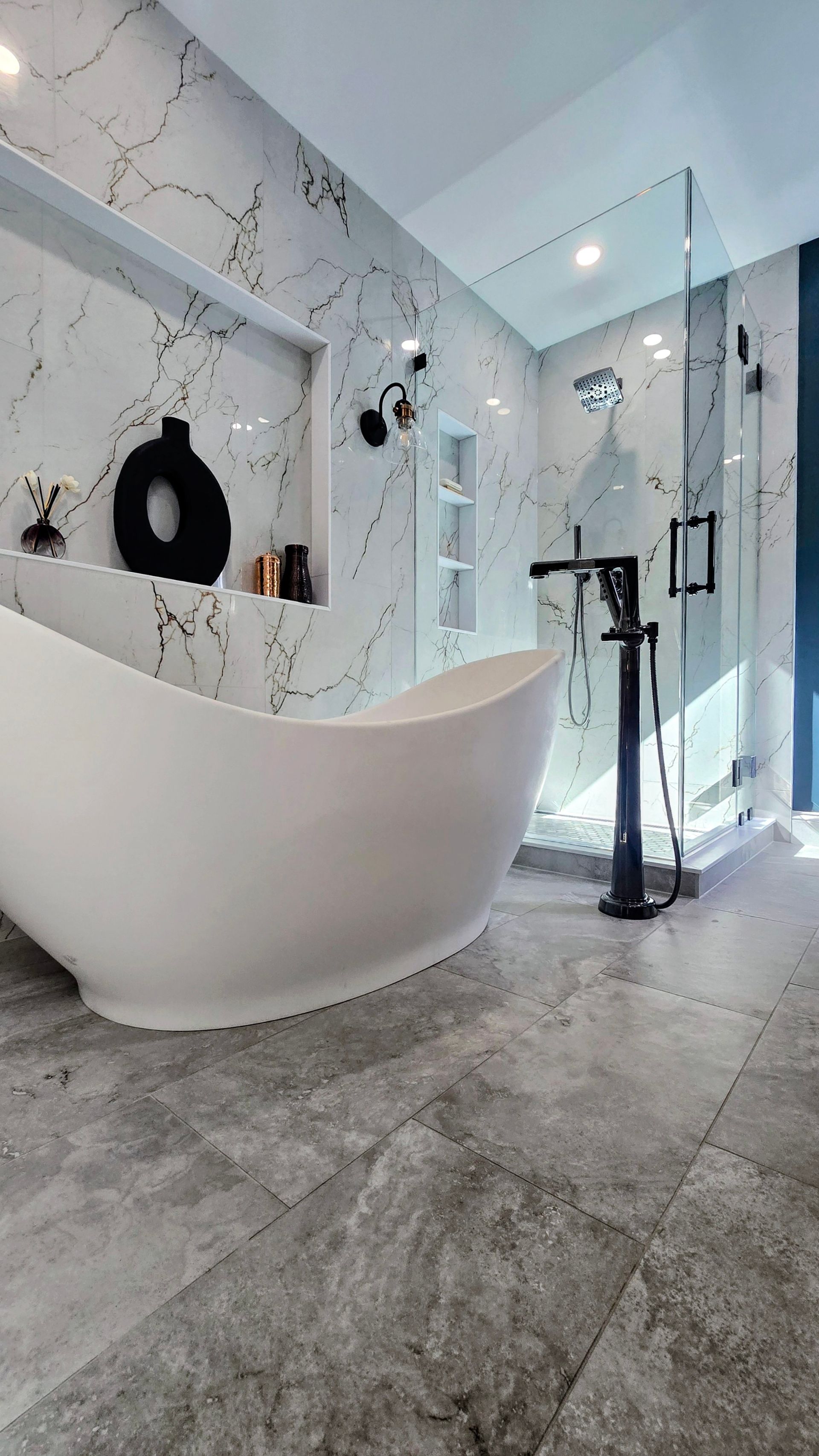 A white bathtub with chrome faucets and a white towel on the side