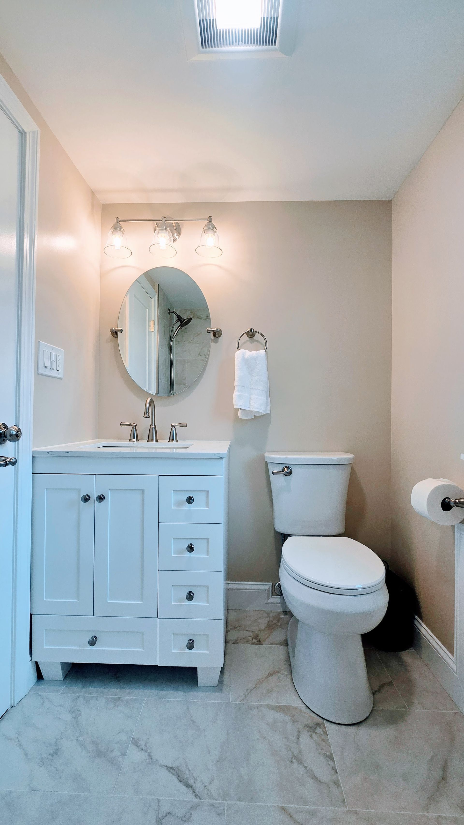 A bathroom with a bathtub and a shower head
