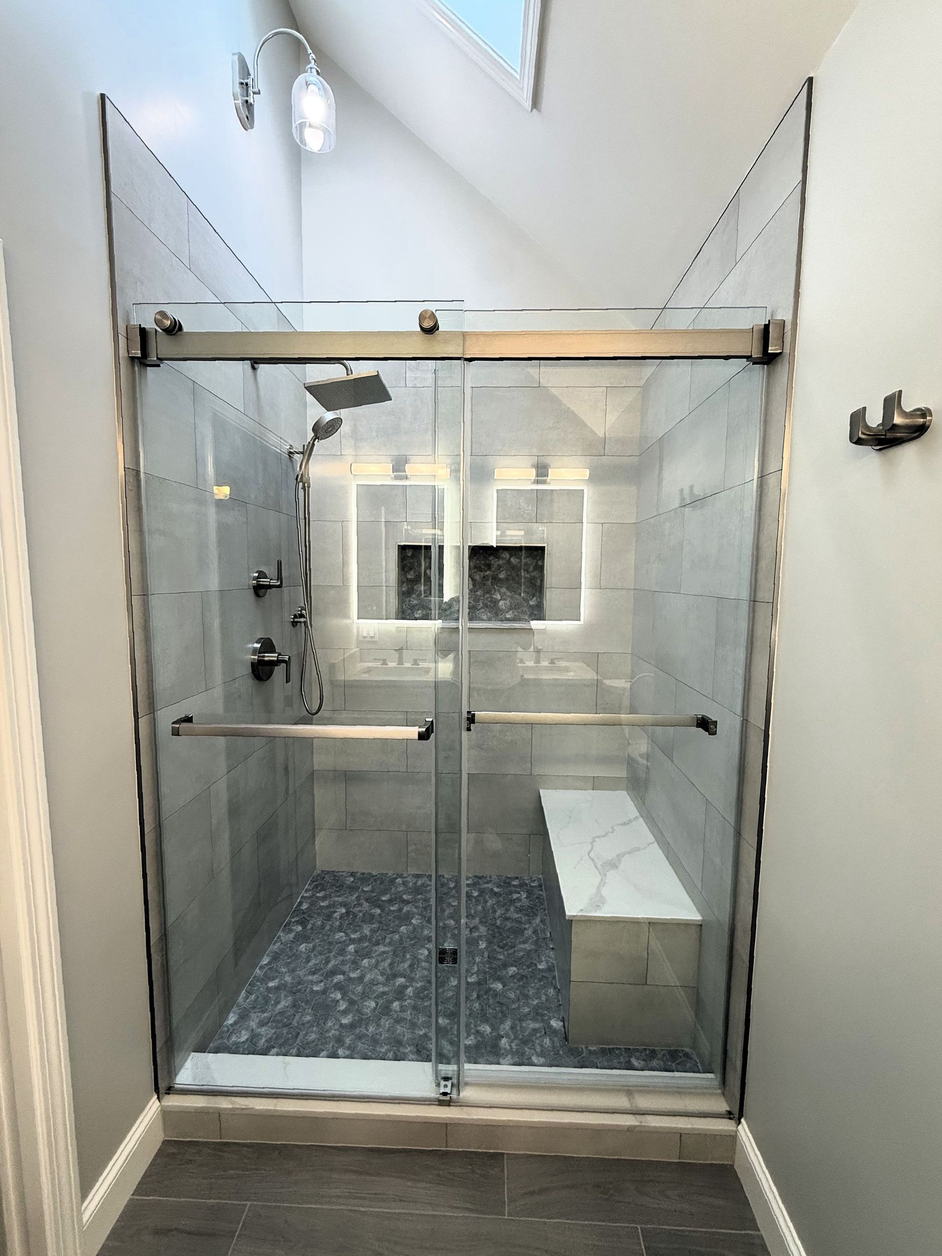 A bathroom with a bathtub and a shower head