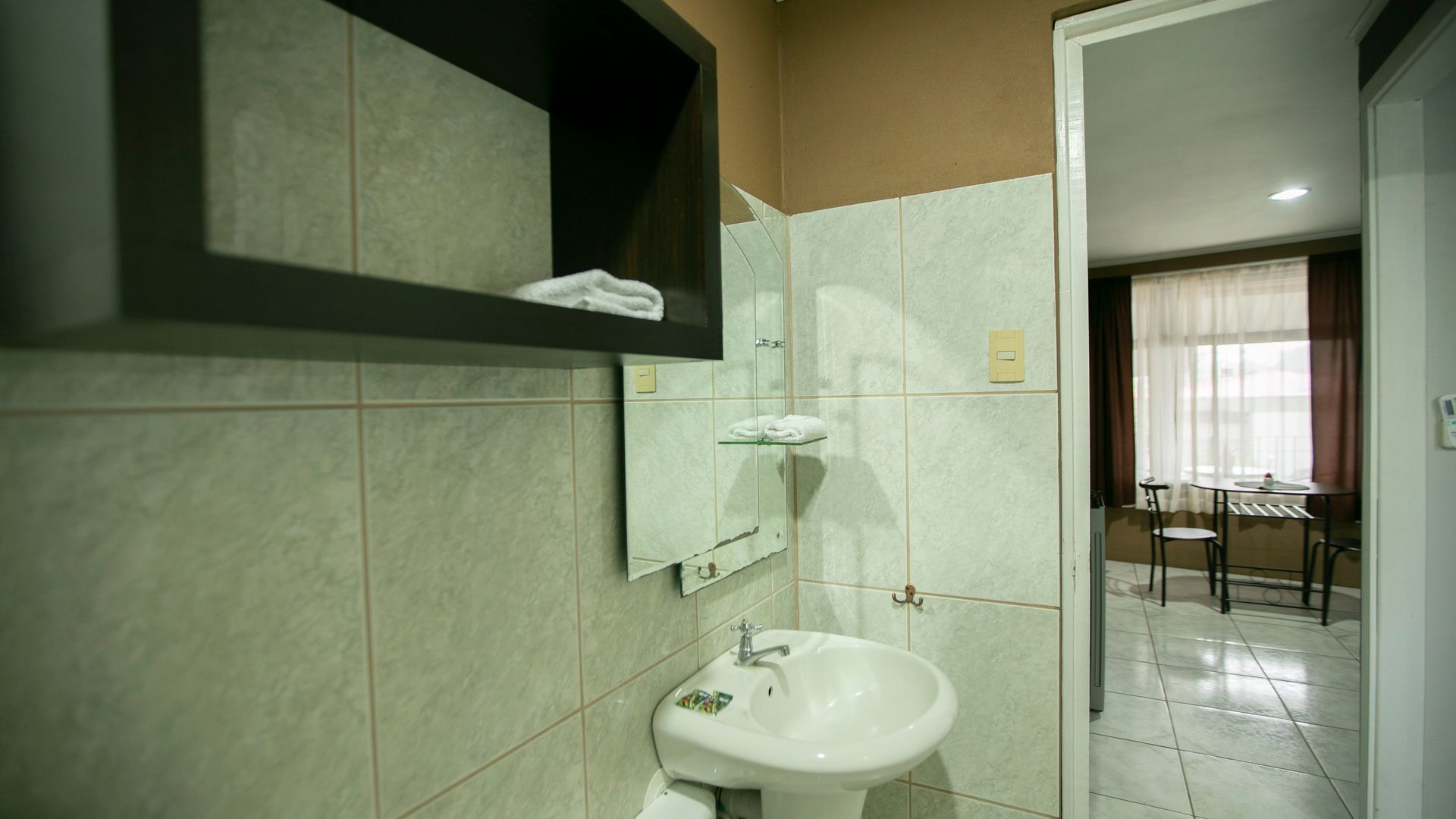 a bathroom with a sink and a mirror .