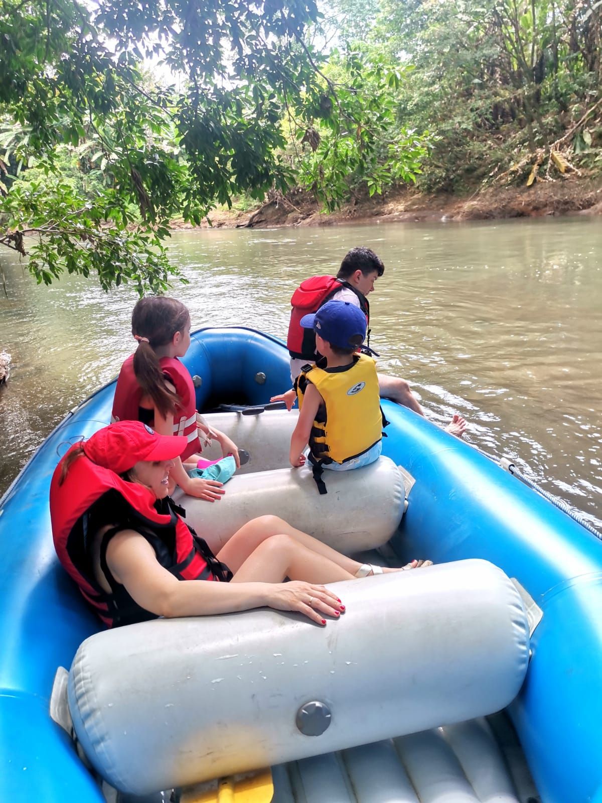 a group of people are in a raft on a river