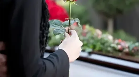 Supportive funeral service scene representing guidance after the death of a loved one