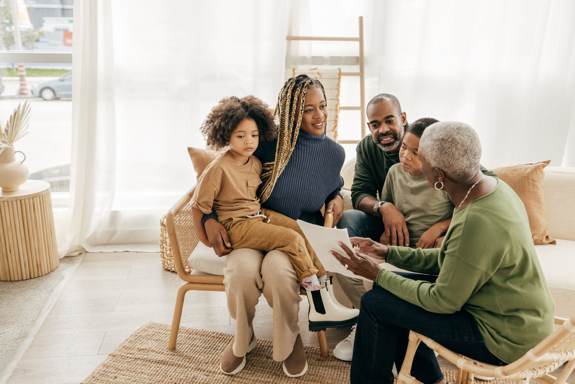 family of 4 sitting on couch