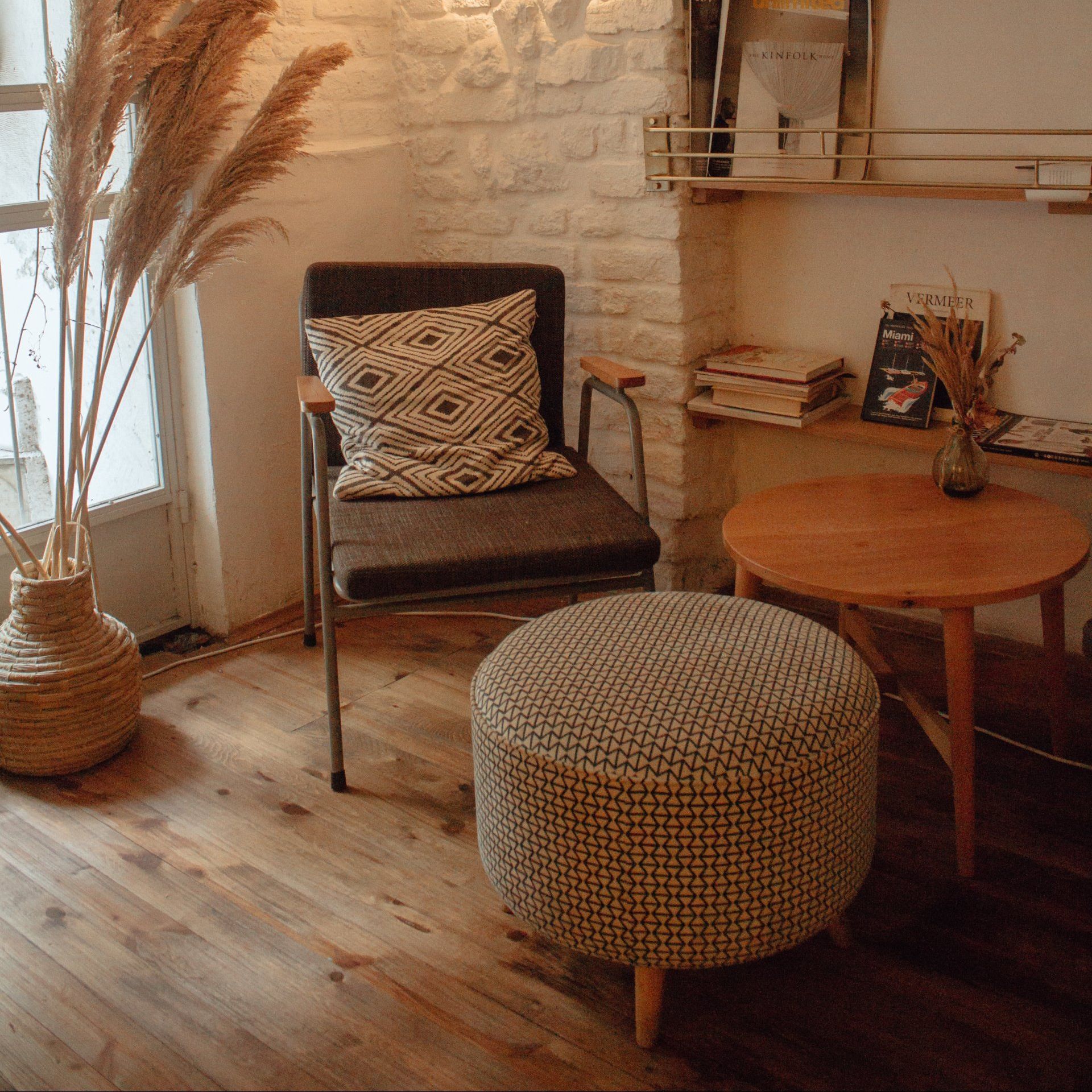 chair and stool on hardwood floors in living room