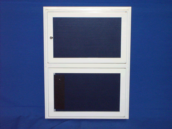 A blue wall with a white cabinet on top of it