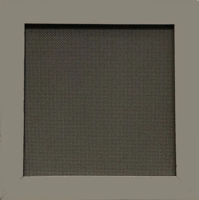A close up of a square screen on a window.