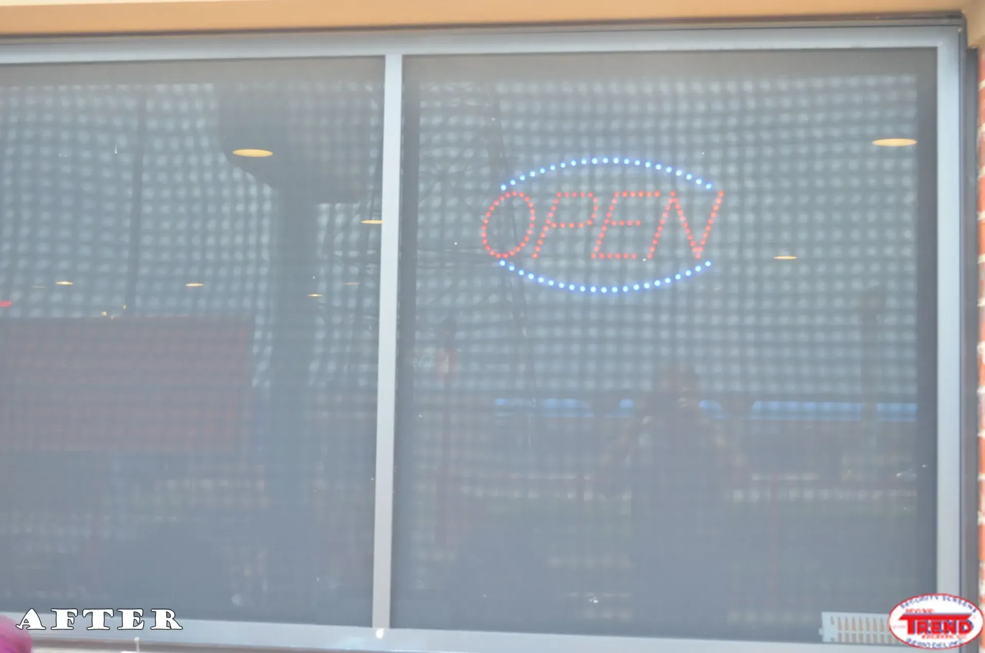 A store window with an open sign on it