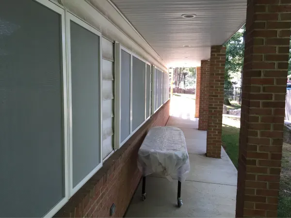 A long hallway with a table on the side of it