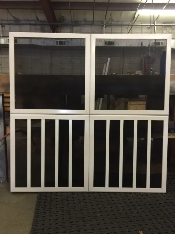 A screened in porch with a white railing
