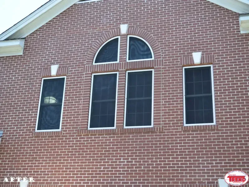 A brick building with a few windows on it