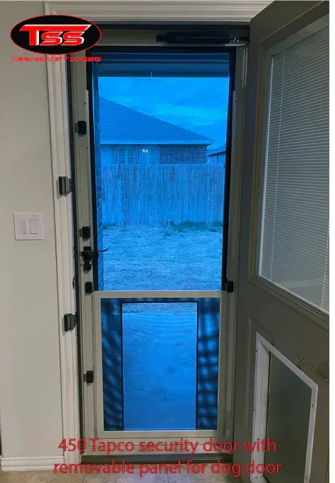 A screen door with a blue screen and a fence in the background.
