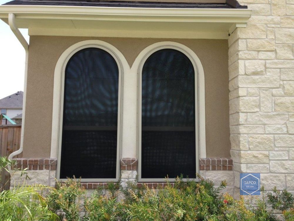 A house with a screened in porch and stairs