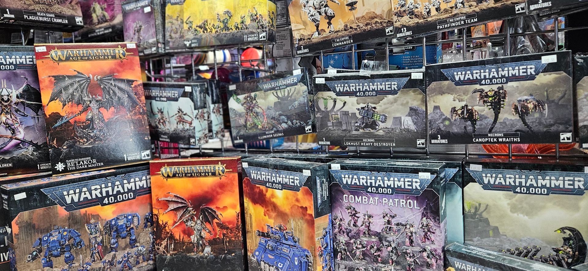 A wide image of Warhammer 40K character sets and combat patrols.
