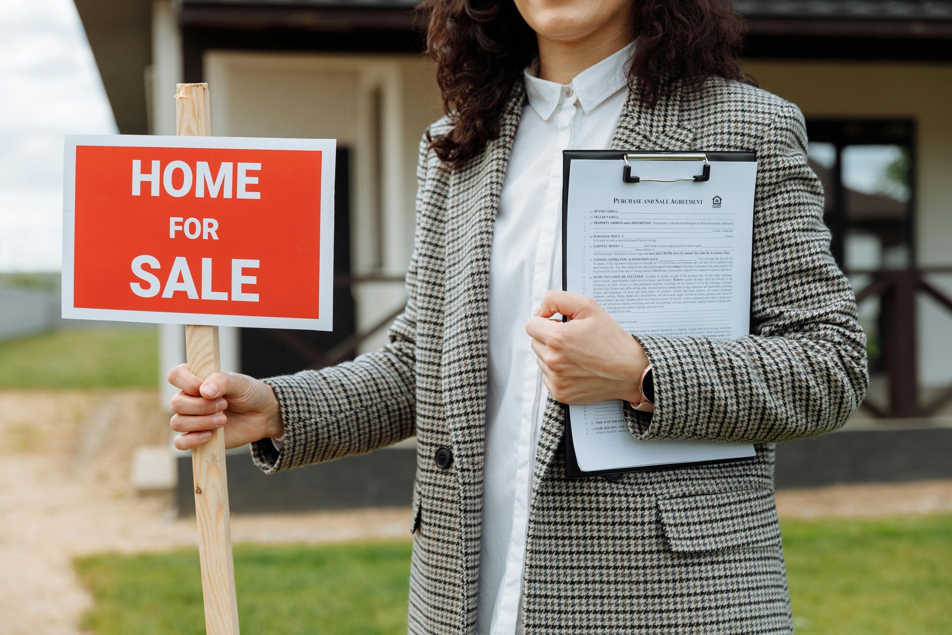 real estate agent home for sale sign