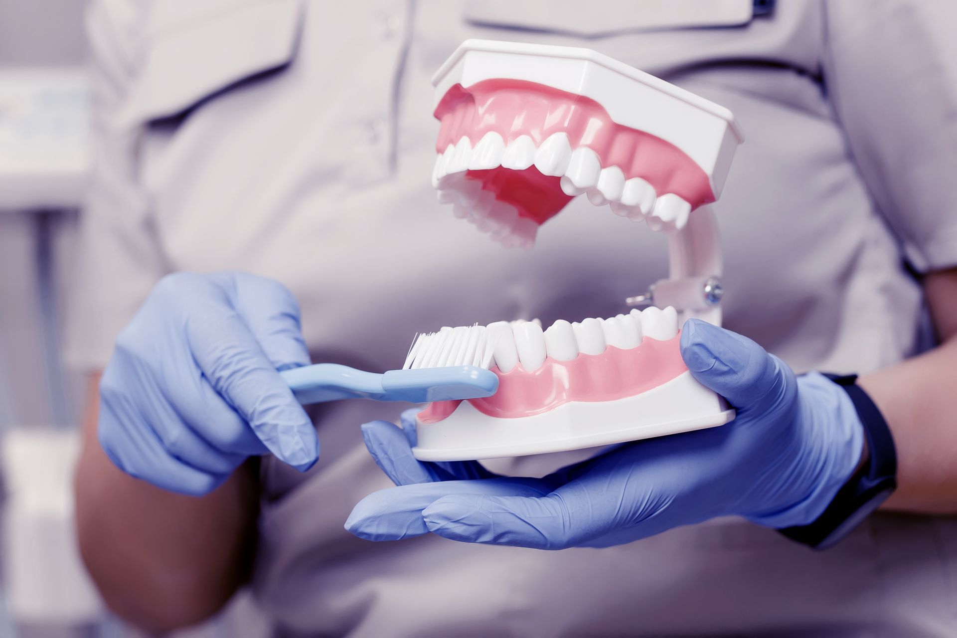 Demonstrating proper toothbrushing for preventive dental care.