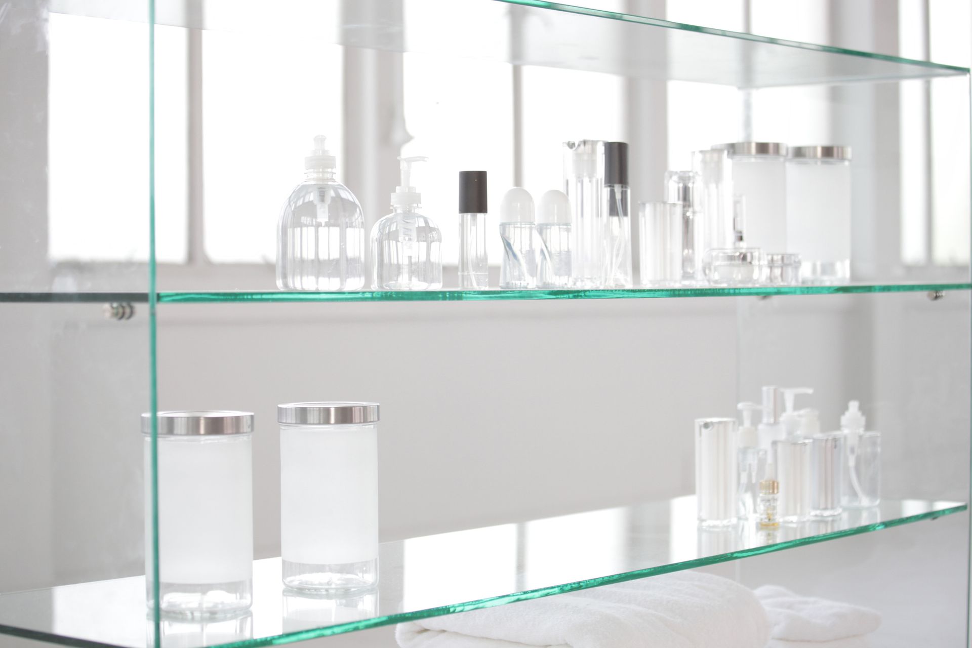 Variety of Glass Bottles on Glass Shelf | Cape Coral, FL | Cape Coral Glass & Mirror